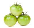 Three green unripe tomato isolated on white background Royalty Free Stock Photo