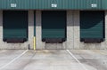 Three green warehouse loading bays