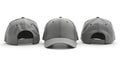 Three grey baseball caps displayed on a white surface from different angles in a studio setting Royalty Free Stock Photo