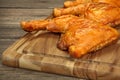 Three Grilled BBQ Chicken Leg Quarter On Wood Board Royalty Free Stock Photo