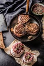 Three grilled beef tenderloin steaks coated bacon on a frying pa Royalty Free Stock Photo