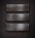 Three grunge rusty metal plates over grid Royalty Free Stock Photo