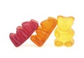 Three gummy bears on white background. Colorful gel bear dessert Royalty Free Stock Photo
