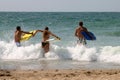 Three guys with bodyboard Royalty Free Stock Photo