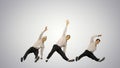 Three guys doing break dance in synch looking at camera on gradi Royalty Free Stock Photo