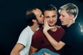 Three guys are gay on dark background Royalty Free Stock Photo