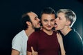Three guys are gay on dark background Royalty Free Stock Photo