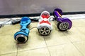 Three gyroscooters are on the charging of batteries