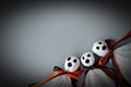 Three halloween ghosts DIY made from white tissue paper, black and orange ribbon on gray background Royalty Free Stock Photo