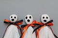 Three halloween ghosts on gray background Royalty Free Stock Photo