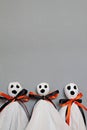 Three halloween ghosts on gray background Royalty Free Stock Photo