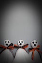 Three halloween ghosts on gray background Royalty Free Stock Photo