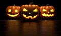 Three halloween pumpkin on dark background. 3D Rendering illustration Royalty Free Stock Photo