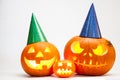 Three Halloween pumpkin head jack lantern with burning candles isolated on white background Royalty Free Stock Photo