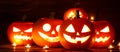 Three Halloween Pumpkins and candles Royalty Free Stock Photo