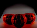 Three Halloween pumpkins in the dark Royalty Free Stock Photo