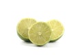 Three halves of limes isolated on white Royalty Free Stock Photo