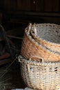 Three hand woven baskets in doorway of barn Royalty Free Stock Photo