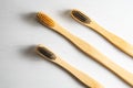 Three handmade bamboo toothbrushes. Ecological and sustainable awareness