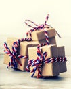 Three handmade gift boxes in shiny colour background. Royalty Free Stock Photo