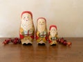 Three Handpainted Wooden Nesting Dolls Painted as Santa Claus in a Row