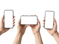 Three hands holding smartphones in a triangular formation Royalty Free Stock Photo