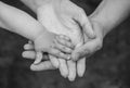 Three hands of the same family - father mother and baby stay together. Royalty Free Stock Photo