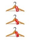 Three hangers with sale and discount tags Royalty Free Stock Photo