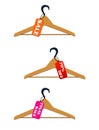 Three hangers with sale and discount tags Royalty Free Stock Photo