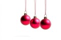 Three hanging Christmas balls are shown isolated on a transparent background Royalty Free Stock Photo