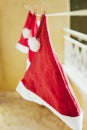 Three hanging Santa hats Royalty Free Stock Photo