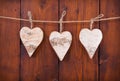 Three hanging wooden hearts.
