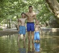 Three happily smiling handsome brothers embracing each other, love family friendship taking care summer sunny mood Royalty Free Stock Photo