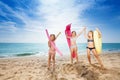 Happy girls with swimming tools on sandy beach Royalty Free Stock Photo