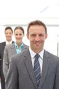 Three happy business people posing in a row Royalty Free Stock Photo