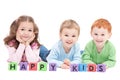 Three happy children with kids blocks