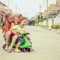 Three happy children playing on the road Royalty Free Stock Photo