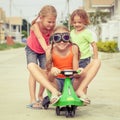 Three happy children playing on the road Royalty Free Stock Photo