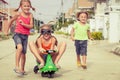 Three happy children playing on the road Royalty Free Stock Photo