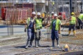 Three happy construction workers posing