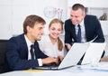 Three happy coworkers different sexes working in company office Royalty Free Stock Photo