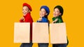 Three Happy Diverse Girls Holding Shopper Bags On Yellow Background