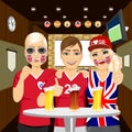 Three happy english soccer fans drinking beer at the pub