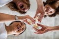 Three happy female friends drinking champagne cheers together laughing having positive emotion Royalty Free Stock Photo