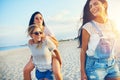 Three happy female friends walking on beach Royalty Free Stock Photo