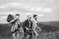 Three happy friends are looking on mountains and having fun together. Group of friends on country walk on a summer day Royalty Free Stock Photo