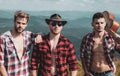 Three happy friends are looking on mountains and having fun together. Young people hiking in nature. Young people on Royalty Free Stock Photo