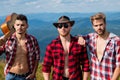 Three happy friends are looking on mountains and having fun together. Young people hiking in nature. Young people on Royalty Free Stock Photo