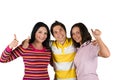 Three happy friends with thumbs-up Royalty Free Stock Photo