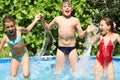 Three happy kids having fun in swimming Royalty Free Stock Photo